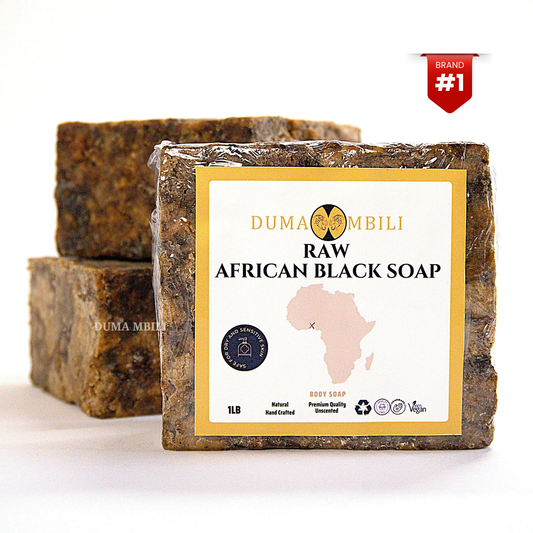 Wrapped 1lb bar of Duma Mbili raw African black soap with two unwrapped bars stacked behind it