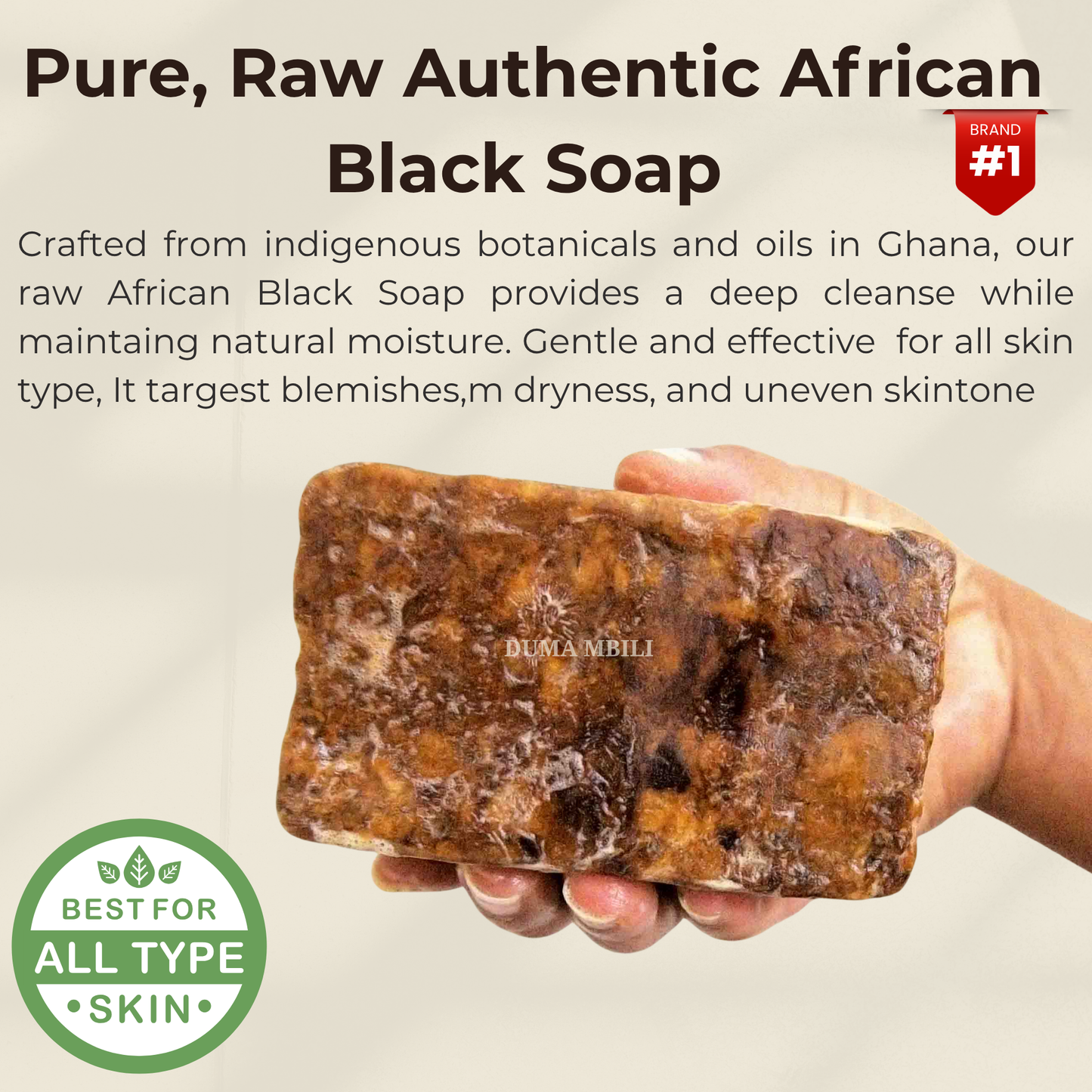 A hand holding a mottled brown bar of raw African black soap made in Ghana